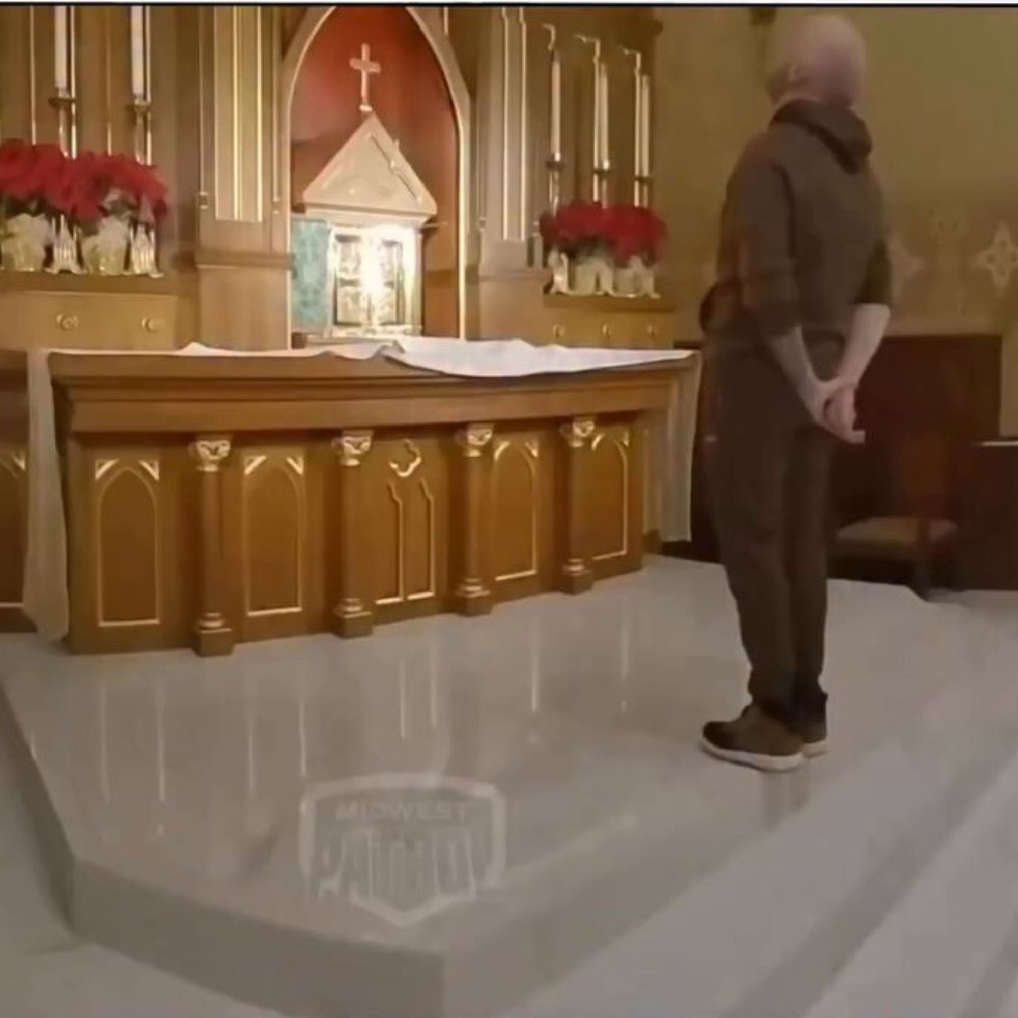 Man attempting to take the Holy Eucharist in a Catholic church, highlighting the importance of reverence for the Blessed Sacrament