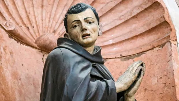 Portrait of St. Paschal Baylon in Franciscan habit kneeling in adoration before the Blessed Sacrament, depicting the saint's profound Eucharistic devotion and mystical prayer.