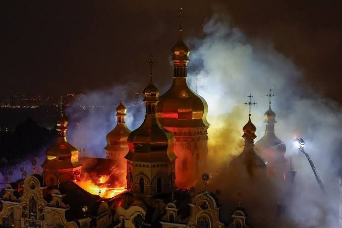 Smoke and debris visible at the Dormition Cathedral in the Kyiv Pechersk Lavra following a reported missile strike, showing damage to the historic Orthodox Christian complex