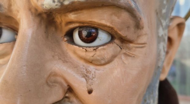 Statue of St. Padre Pio at Santa Maria delle Grazie parish in Casalba, Italy, showing a reddish tear resembling blood from its left eye