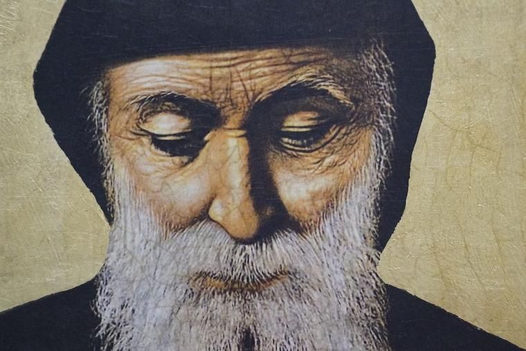 Close-up icon of Saint Charbel Makhlouf, Lebanese Maronite monk and saint, with gold background