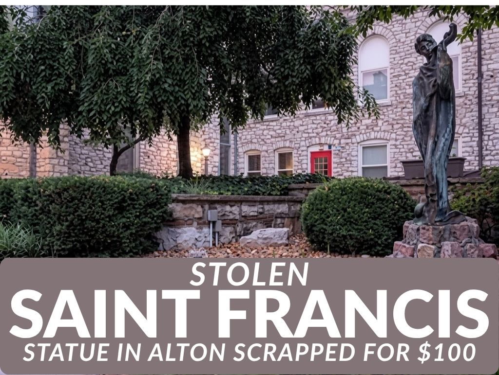 Stolen Saint Francis statue standing beside a fountain in the garden of the Episcopal Parish of Alton